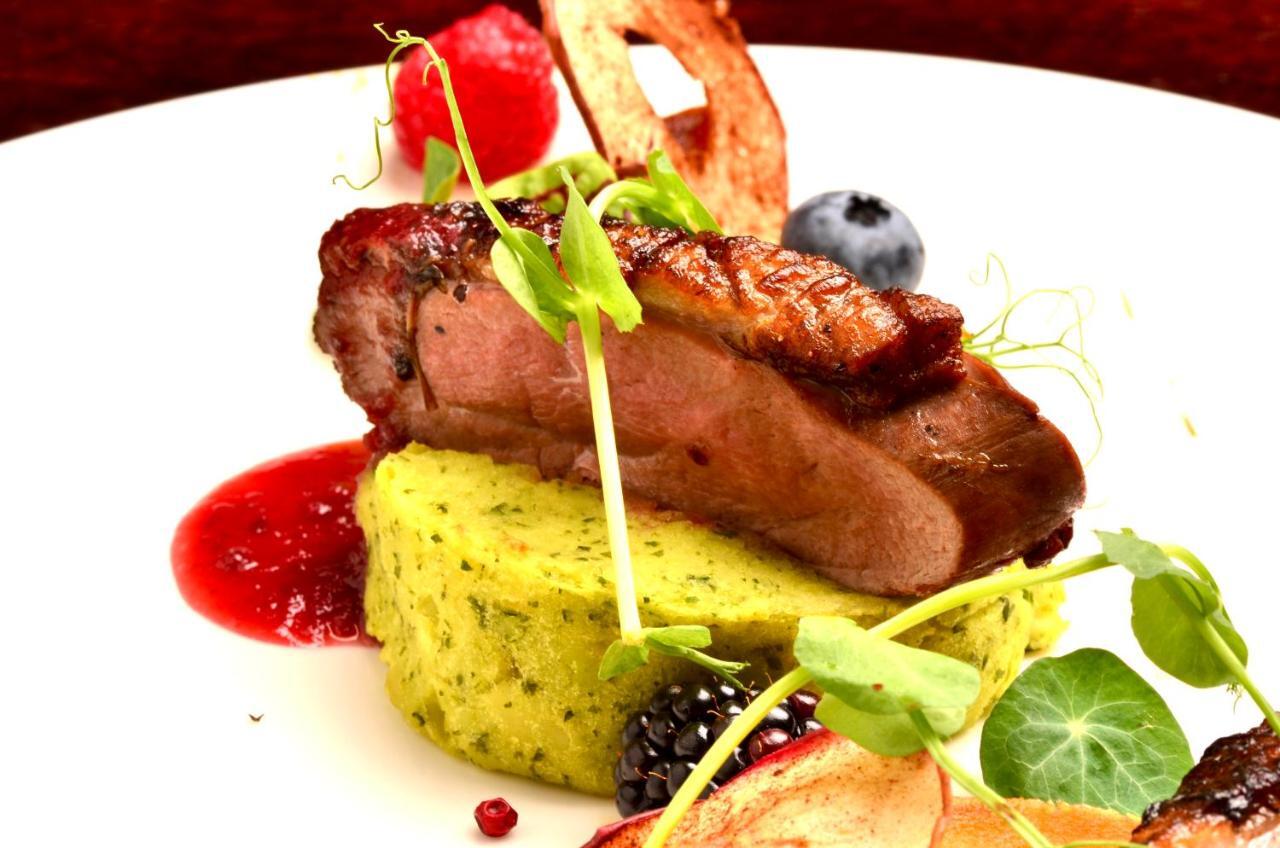 Hotel Grodek Krakow Exterior photo A duck confit dish